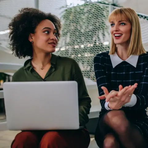 A team member sharing an idea with a colleague
